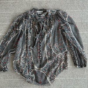 Isabel Marant silk translucent shirt, with a neck tie.